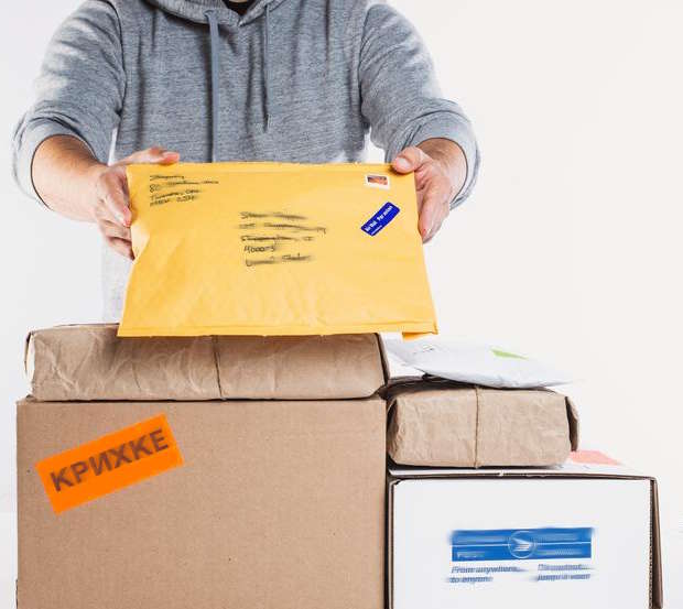 a man holding up packages for fulfillment kryhke